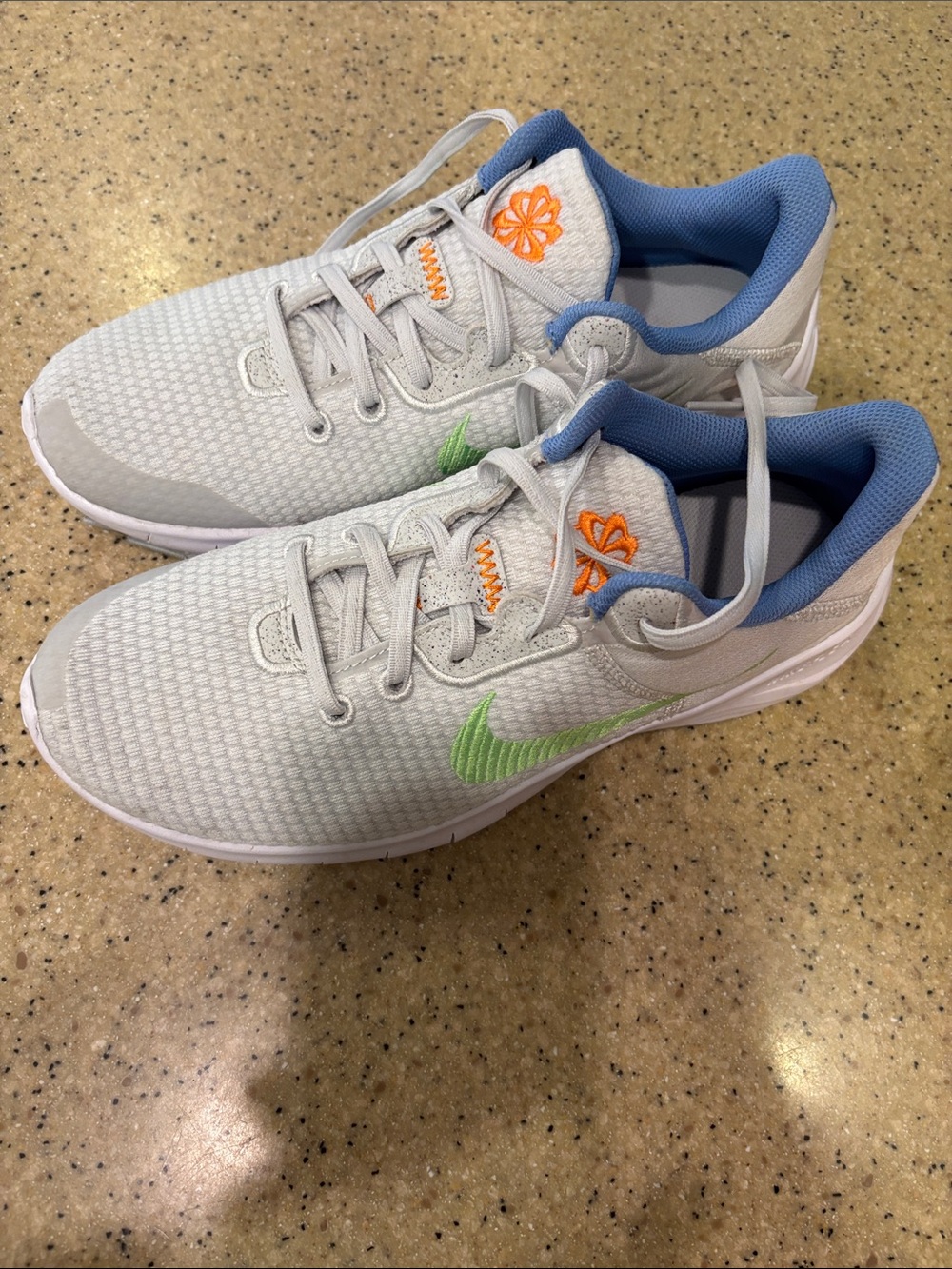 Nike Women’s Light Gray Sneakers with Blue Lining and Green & Orange Accents